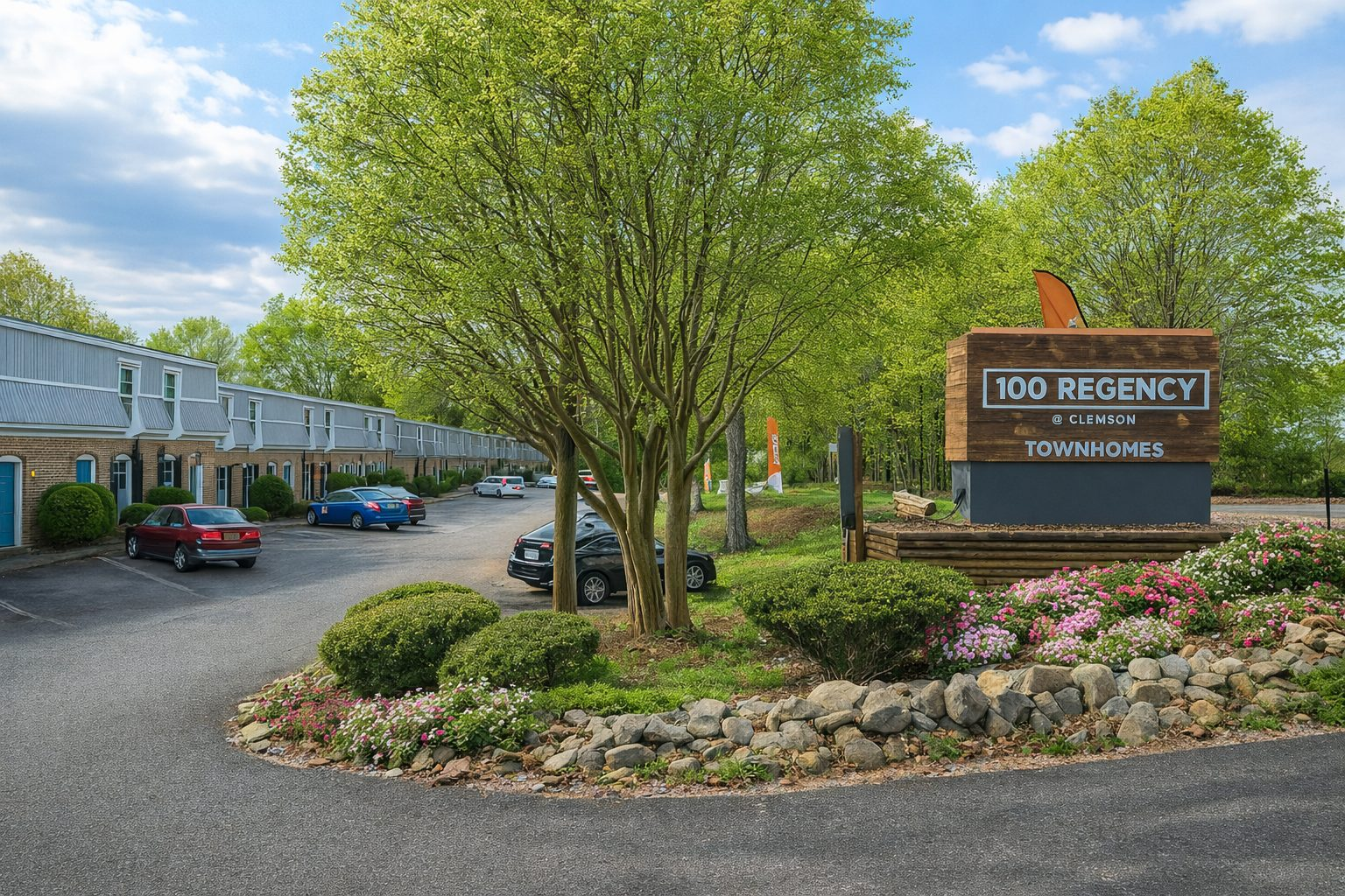The landscaped entrance and townhome buildings at 100 Regency at Clemson